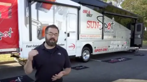 Sun-Spot Roadshow spokesman in front of rig | Sun-Spot